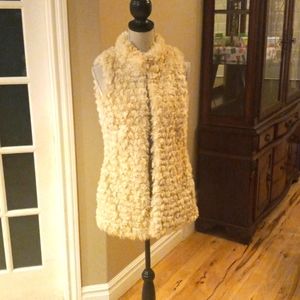 Cream colored, lined faux fur vest